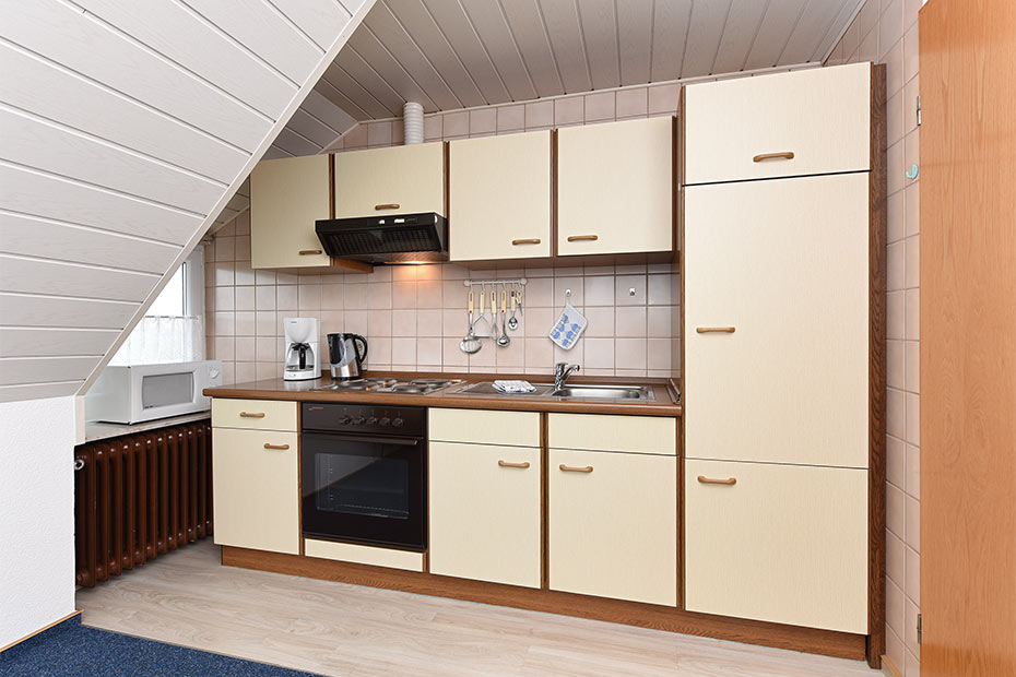 Ferienwohnung „Wangerooge“ - Wohnzimmer mit integriertem Küchenbereich