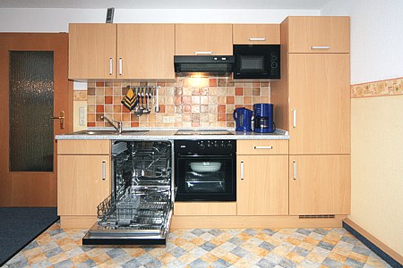 Ferienwohnung „Seestern“ - Wohnzimmer mit integriertem Küchenbereich