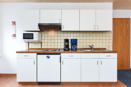 Ferienwohnung 2 - Wohnzimmer mit integriertem Küchenbereich