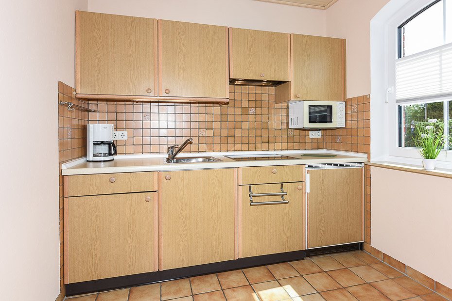 Ferienwohnung „Erdgeschoss“ - Wohnzimmer mit integriertem Küchenbereich